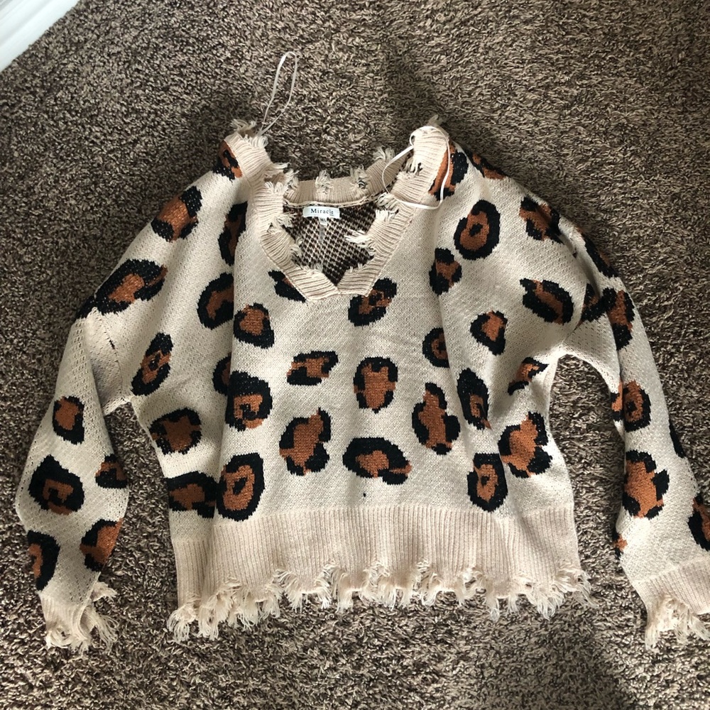 Super adorable leopard print distressed sweater